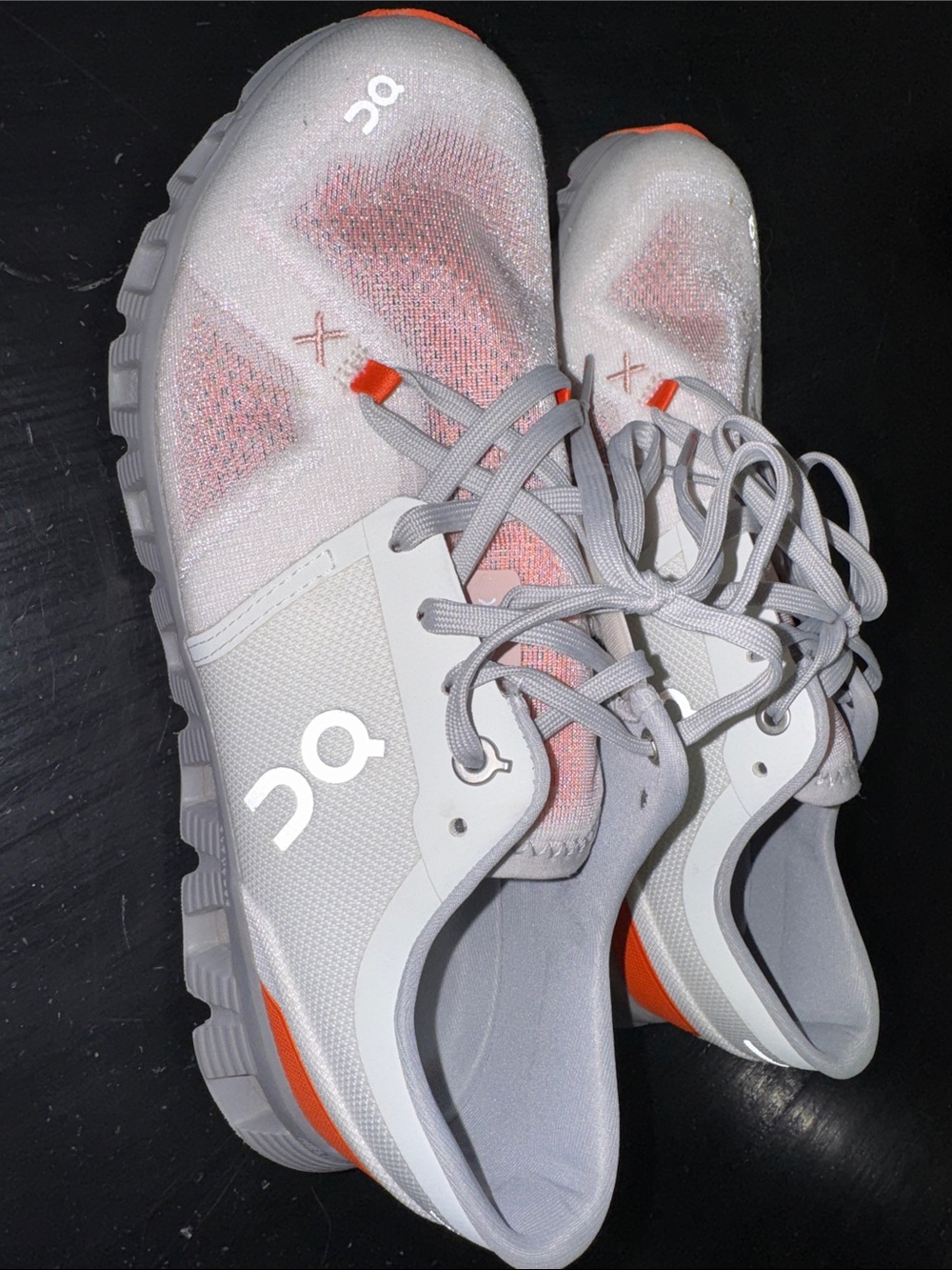 on cloud x 3. orange and white. size US women’s 9. good used condition.